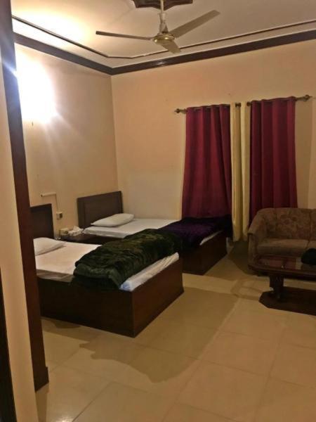 Hotel Babar House à Faisalabad Extérieur photo